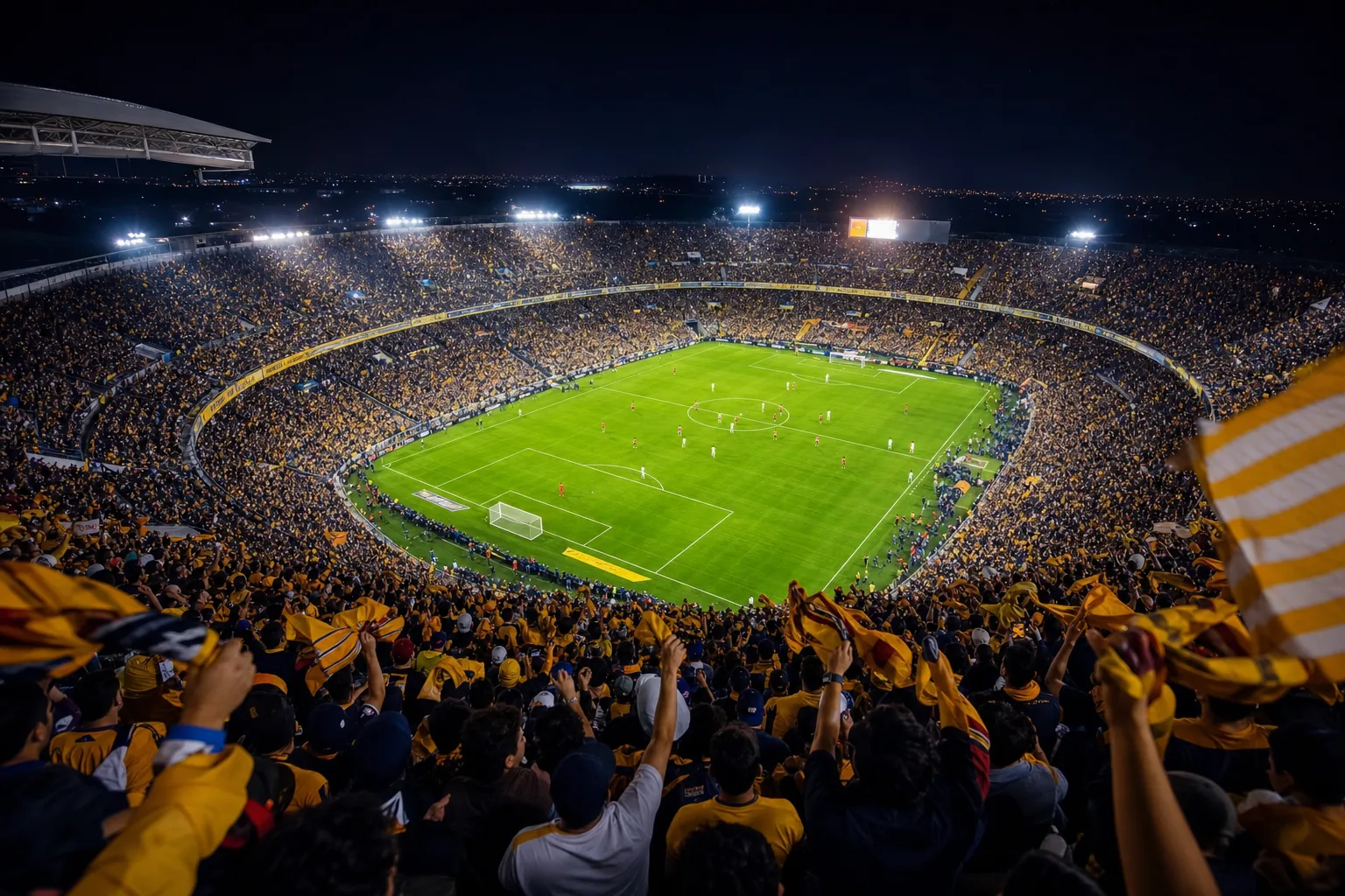 Packed football stadium at night